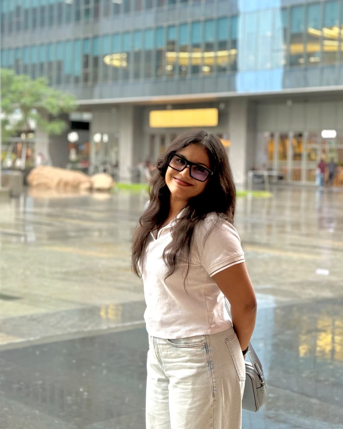 Supriya outdoors in a white outfit